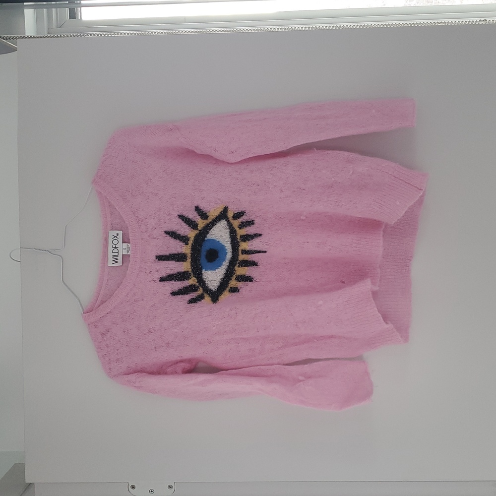 Wildfox pink sweater with eye on front.